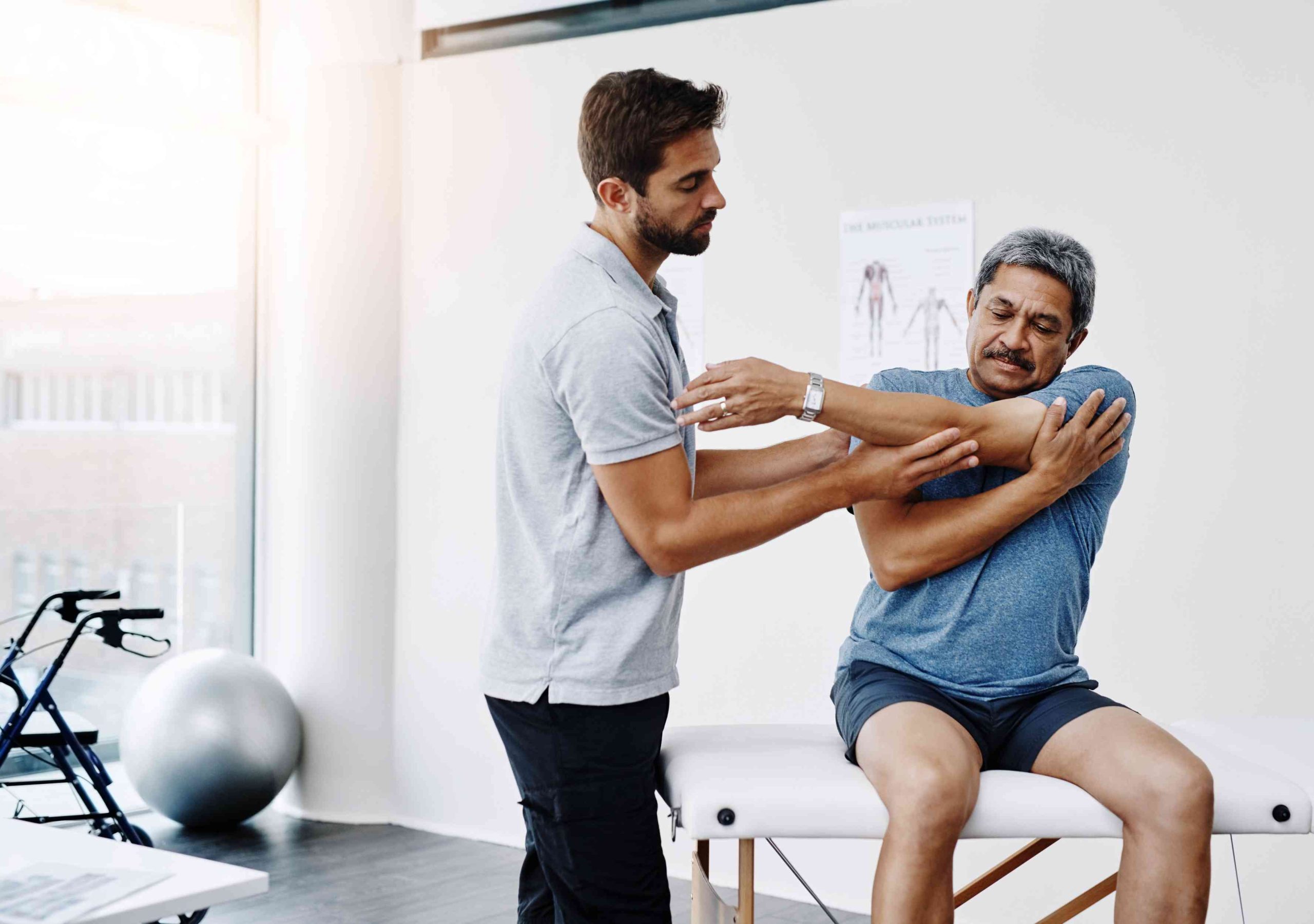 Physiotherapist assisting patient through treatment process at Enspire clinic
